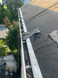 clogged gutters roof damage