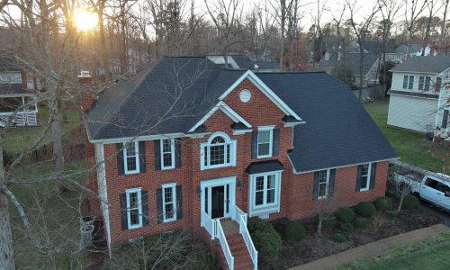 When to replace a roof? Aging asphalt shingle roof showing cracked shingles, curling edges, that are the signs you need a new roof